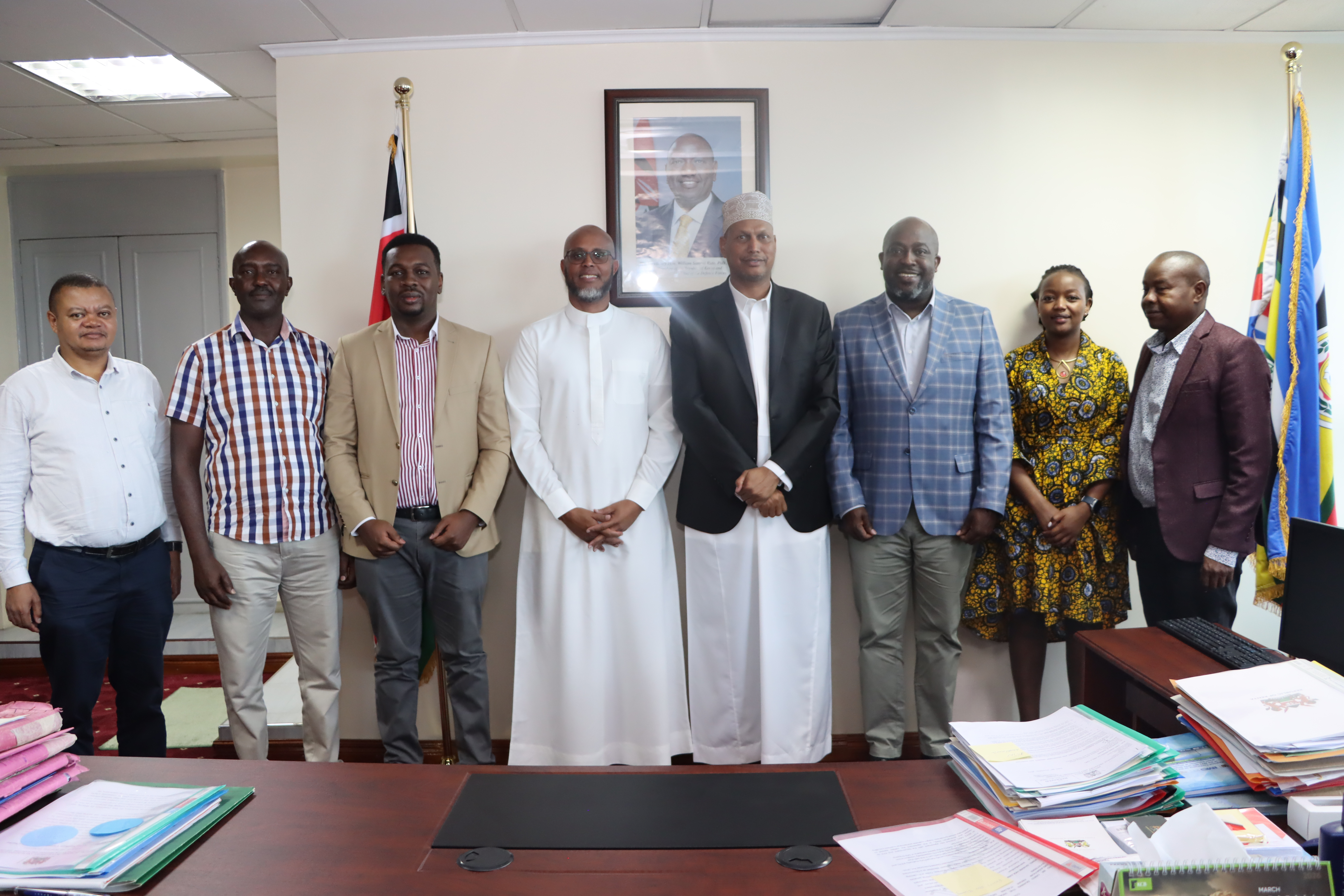 PS Aden Millah posing for a photo with a delegation from TradeMark Africa 
