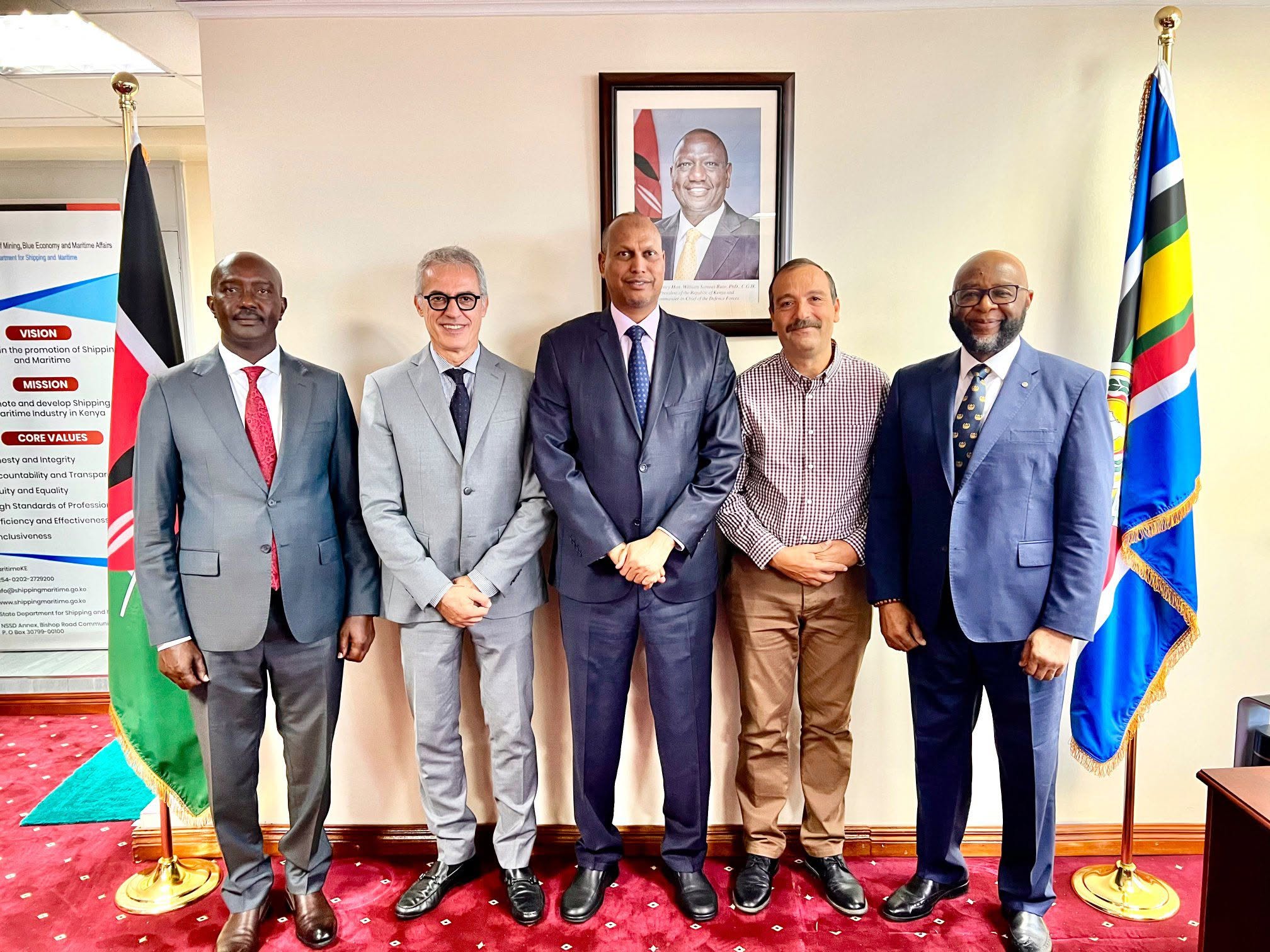Photo: The Principal Secretary State Department for Shipping and Maritime Affairs Mr. Aden A. Millah, in the middle and in a navy-blue suit, posing for a photo with the delegation undertaking the Regional Policy on Port Security and Safety of Navigation in the Eastern Africa-Southern Africa-Indian Ocean (EA-SA-IO) region.