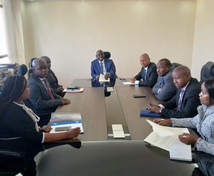 Principal Secretary State Department for Immigration and Citizen Services Dr. Belio Kipsang chairing a consultative meeting, and on the immediate left is the Principal Secretary State Department for Shipping and Maritime Affairs Aden Millah.