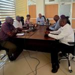 PS Millah chairing a strategic meeting with KNSL management.